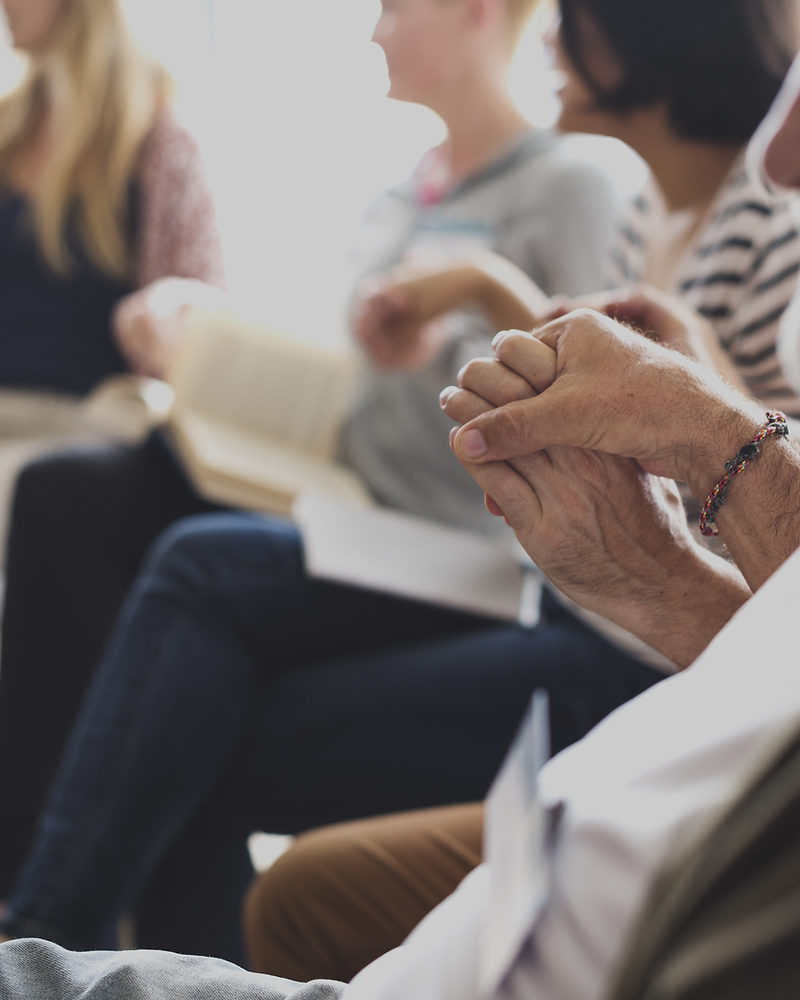 Two people holding hands